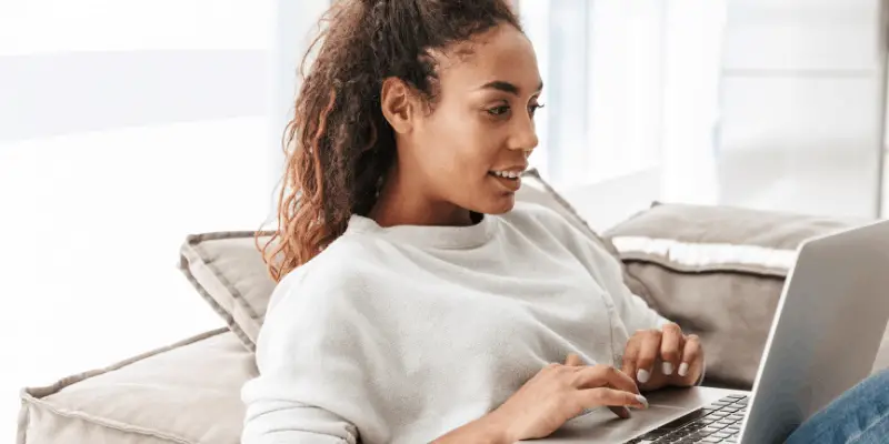 woman typing on laptop