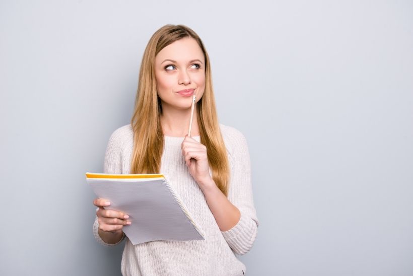 woman thinking about what to write