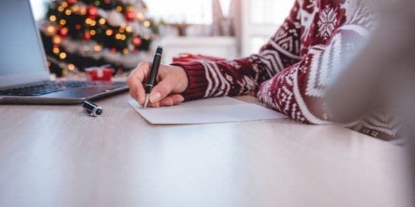 woman writing greeting cards