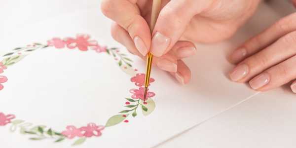 woman drawing floral illustration