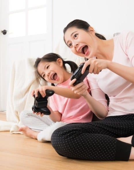 mother and daughter playing video games