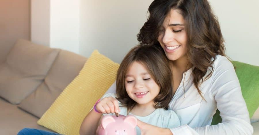 mom and child using piggy bank