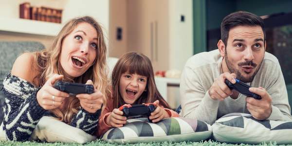 FAMILY PLAYING VIDEO GAMES
